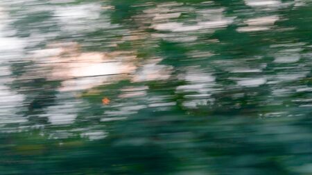 Abstract motion blur background image. Useful stuff for web and graphic design works. High speed moving object. Long exposure high contrast light effect.の写真素材