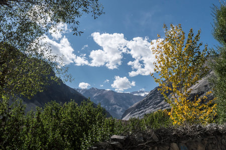 Distant Highland mountain hill range in summer with floating clouds framing the backdrop on...