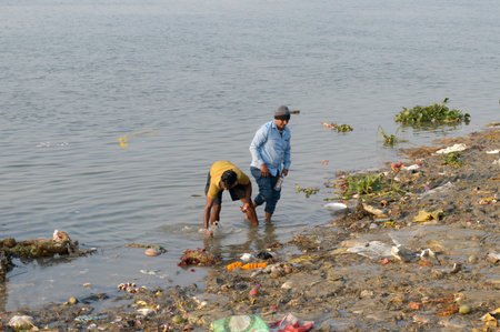 People in the Polluted Ganges River with Routine Human Activities. Holy Ganga is unfit for drinking,...