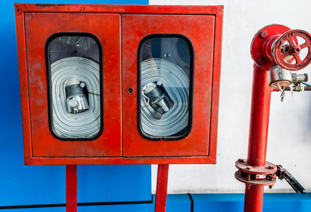 Wall Hanging Fire Extinguisher, Fire Safety and Emergency Equipment install in Red Blue Box wall...