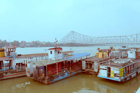 Fairlie Place Ghat Ferry Terminal bridge, a Ferry service transportation a quick way to travel for commuters from bank of the River Hooghly river that connects the Kolkata and Howrah city. India South Asia Pacific March 2020のeditorial素材