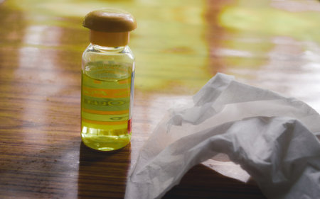 Polio vaccine vaccination bottle and Hand Sanitizer napkin, disinfecting products on table to...