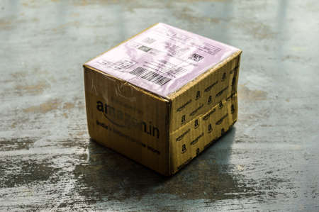Close-up Amazon Prime package box unpacked after delivery on Amazon Prime Day. Amazon Logo printed on Amazon delivery box. Kolkata India South Asia Pac June 8, 2020.のeditorial素材