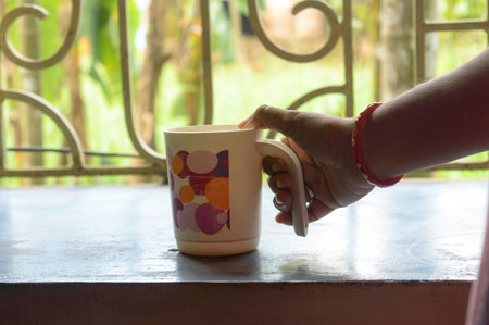 Woman Hand holding coffee cup. Close Up Of Human Hand Holding a Coffee Cup. Female hand hold take...