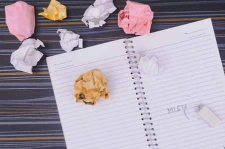 Erasing Mistake on notepad. Learning, wrong, blooper, regret sayings background. Fault, defect,...