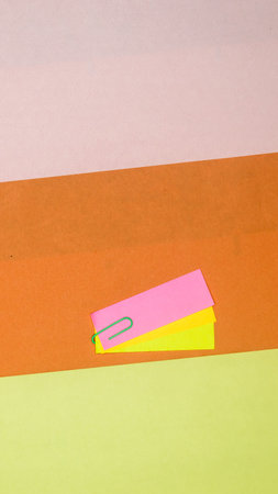 Paper clip Attachment on Kraft paper. Abstract background color art minimalist design. Vertical. Flat Lay.の写真素材