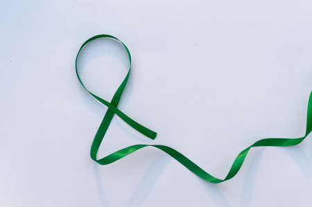 Green Ribbon on white background. Table top view. copy space for textの写真素材