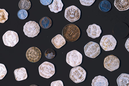 Mix of old antique obsolete Indian Rupee Coin currency on rustic floor. Full Frame. Table Top View. Close Upの写真素材