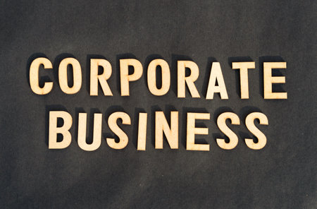Corporate word and business concept. Wooden cubes words Corporate Business isolated on black background. Business Finance Industry concept.の写真素材