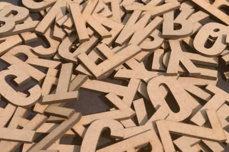 Brown DIY Word Wooden Letters Alphabet for Art Crafts Home Decor on table. Design decoration background Concept.の写真素材