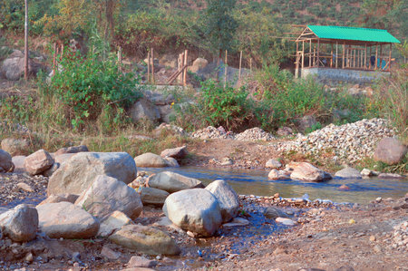 Boulder Rocks in the middle of a mountain river. Tabakoshi Rangbang river mountain valley Mirik West Bengal Indiaの写真素材