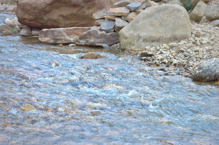 Rocky River mountain streams flowing through the rocks and pebbles of north east section of the...