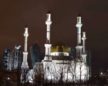 Mosque on a winter night. Astana. Kazakhstan. Visible central part of city.の写真素材