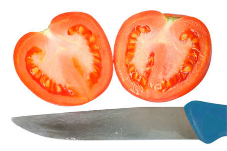 sliced tomato in the shape of heart and a knife. Association with the parting, unrequited love, separation, machinations. Isolated on white backgroundの写真素材