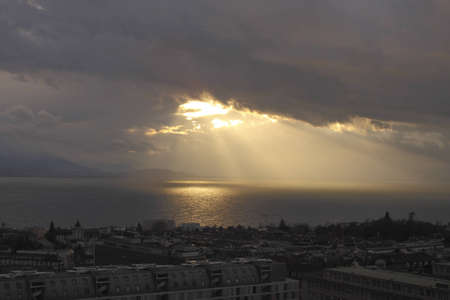 last rays  of the setting sun, falling on the water. Gloomy evening landscape.の写真素材