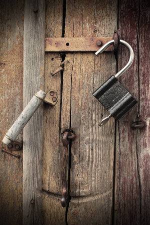 fragment of an old, unlocked the door. photo of retro style.