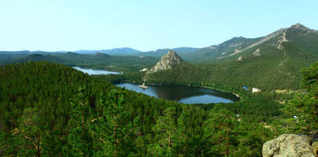bright summer landscape depicting a lake Borovoe and rocks; covered with coniferous forestの写真素材