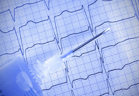 Medical needle with syringe on ECG  Monochrome photoの写真素材