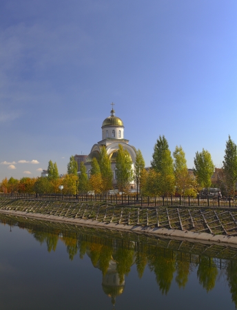 Orthodox chapel and its reflection in the river の写真素材