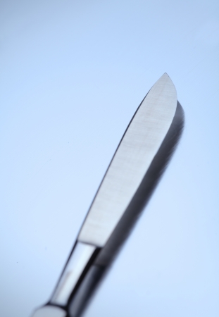 Sharp surgical scalpel on a metal .の写真素材