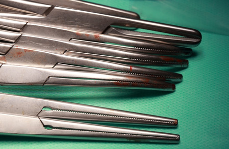 surgical instruments in a rowの写真素材