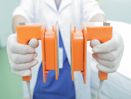 Medical defibrillator in the hands of the doctorの写真素材