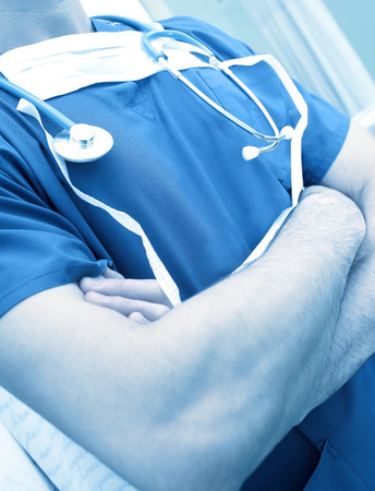 Doctor standing in a hospital room. close-up photoの写真素材