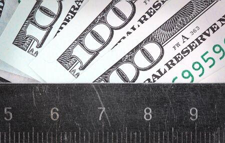 Amount of money measured a ruler conceptの写真素材