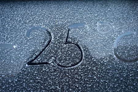 Frosty glass and sign on it the concept of cold weatherの写真素材