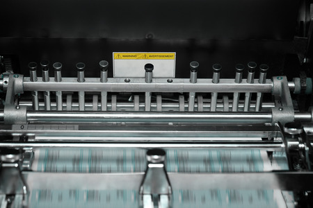 Printing machine with blurred conveyor beltの写真素材