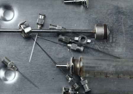 Steel medical instruments in the old tray