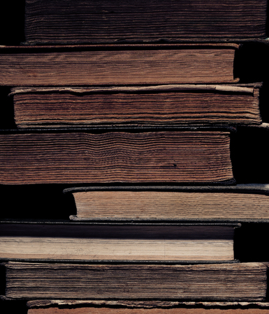 Library of ancient books in a stack.の写真素材