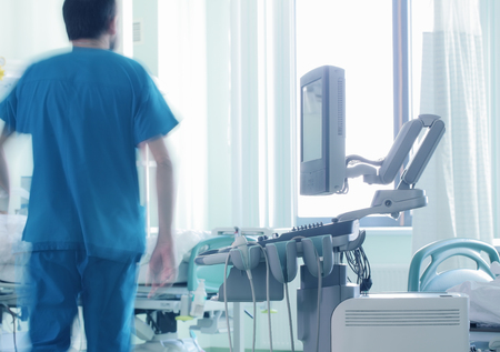 Doctor watching the patient in hospital ICUの写真素材