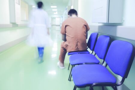 Lonely patient in hospital corridor.の写真素材