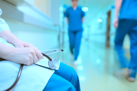 Tired doctor in hospital hall.の写真素材