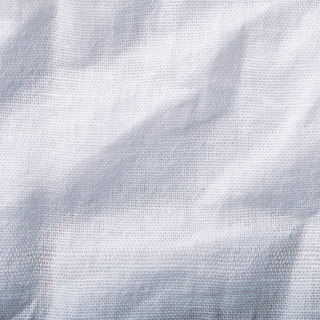 Tissue with uneven folded surface macro background photoの写真素材