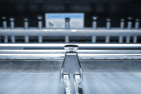 Blurred conveyor belt of printing pressの写真素材