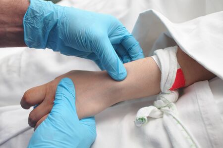 Doctor feels the patient's pulse.の写真素材