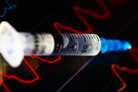 Syringe on the medical monitor.