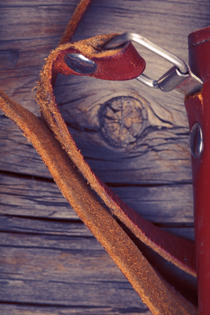 Leather case for the old camera on the wood background.の写真素材