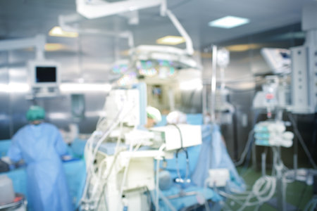 Hospital operating room, unfocused background.