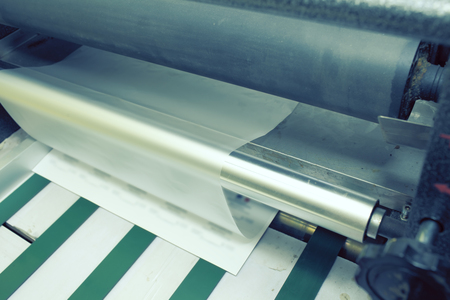 Laminating unit in the print shop.の写真素材