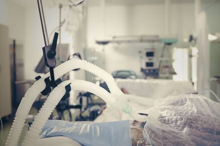 Patient with the breathing equipment in intensive care department.の写真素材