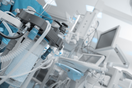 Fragment of breathing apparatus in the operating room filled with instruments and machines.の写真素材