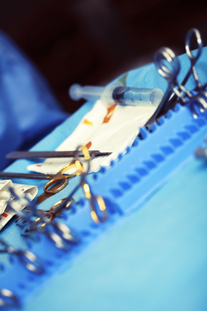 Sterile table with used surgical tools during wound dressing.の写真素材