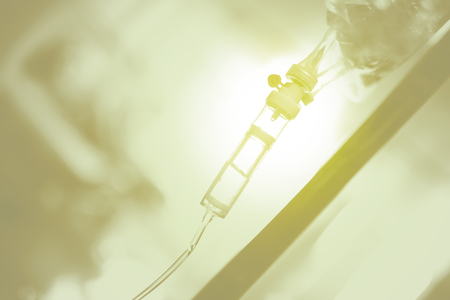 Medical background with solution hanging on the medical pole.の写真素材