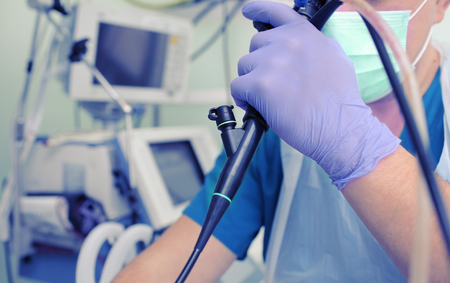 Working doctor during medical procedure.の写真素材