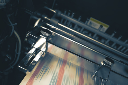 Printing press with blurred belt during printing process.の写真素材