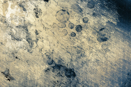 Old steel surface covered with black spots, textured background.