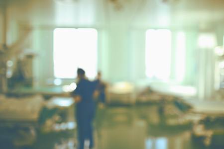 Working nurses on day shift in the intensive care unit, unfocused background.の写真素材